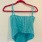 Out from under blue corset