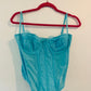 Out from under blue corset