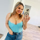 Out from under blue corset
