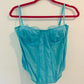 Out from under blue corset