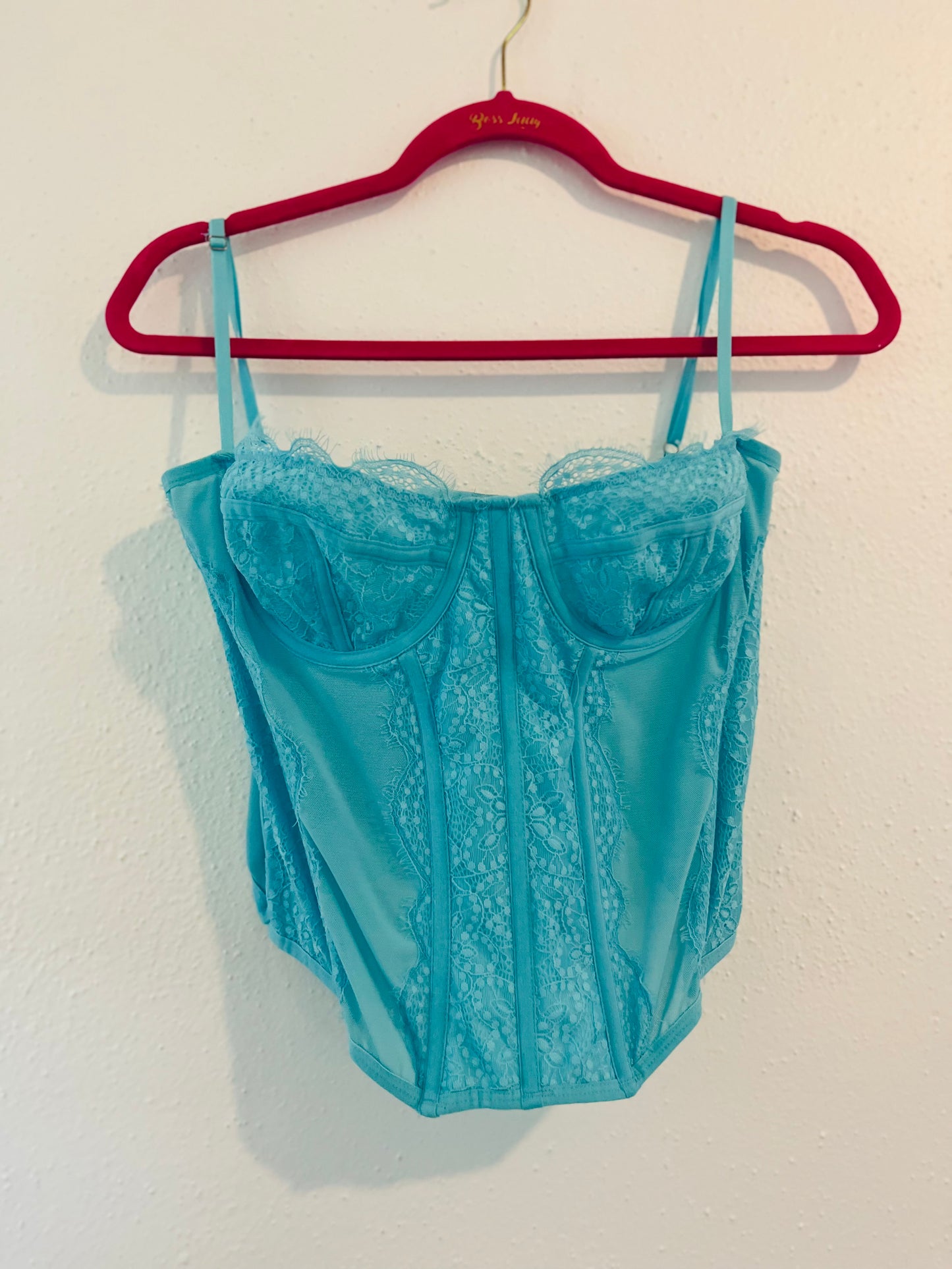Out from under blue corset