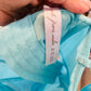 Out from under blue corset